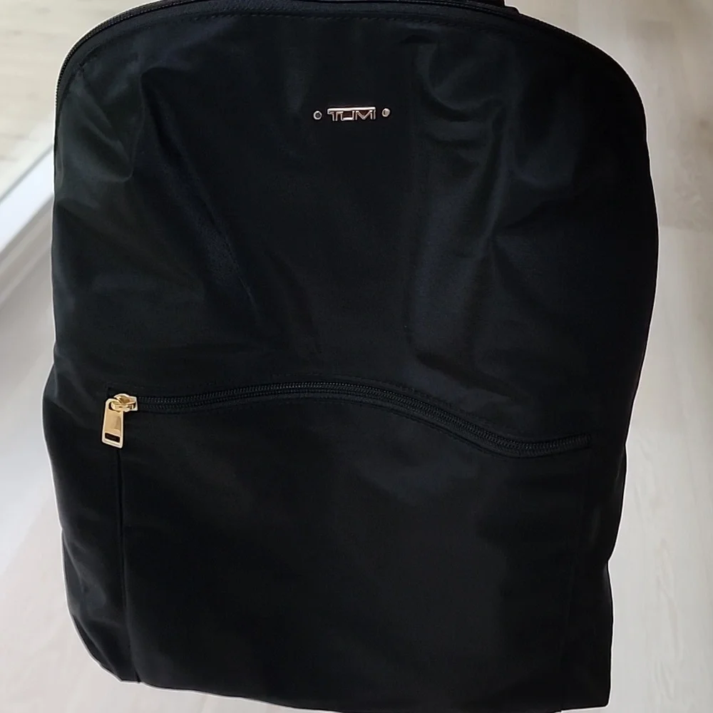 NWOT Tumi Just in Case Backpack in Black and Gold